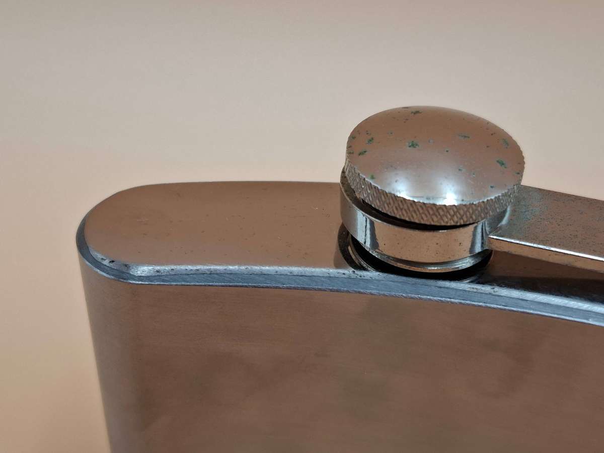 Vintage Stainless Steel Hip Flask - Curved Design with Screw-on Cap connected to Flask