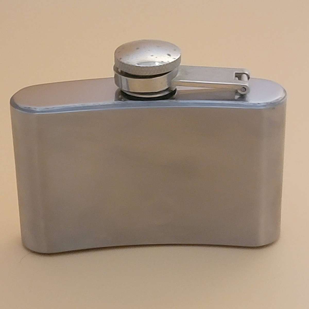Vintage Stainless Steel Hip Flask - Curved Design with Screw-on Cap connected to Flask