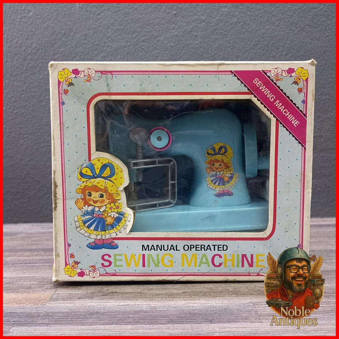 Vintage Boxed Little Miss Homemaker manual-operated toy sewing machine