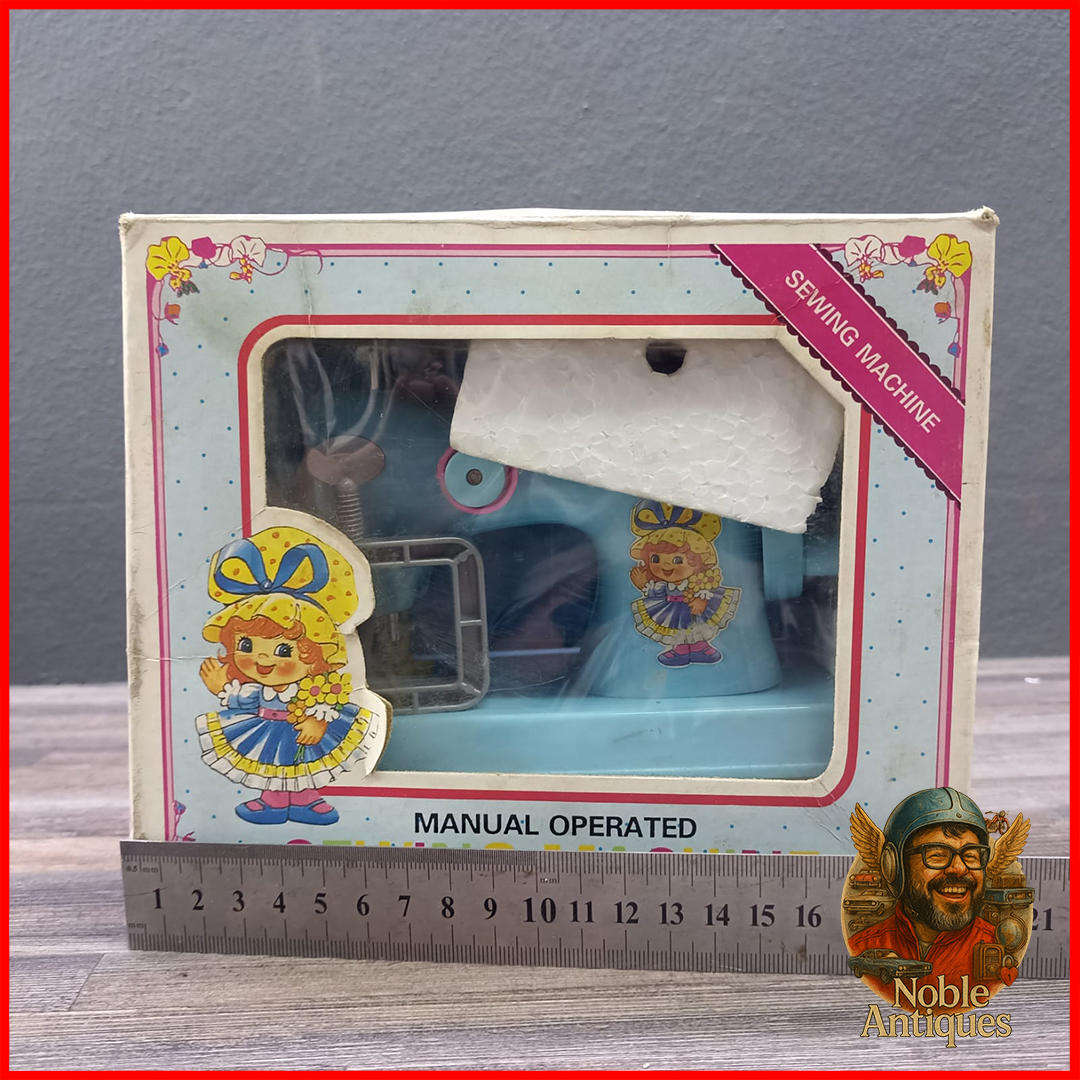 Vintage Boxed Little Miss Homemaker manual-operated toy sewing machine