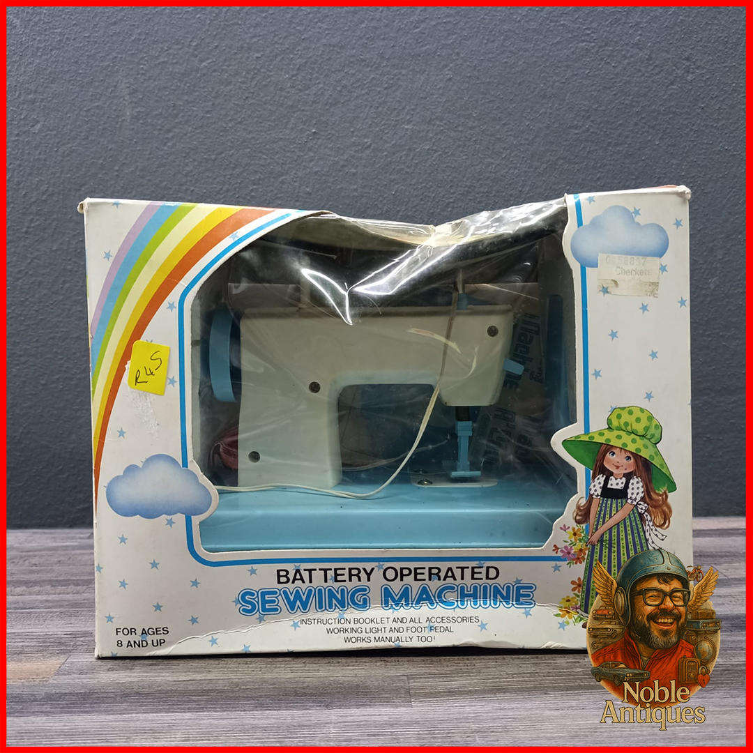 Vintage Boxed Rainbow Girl battery-operated toy sewing machine