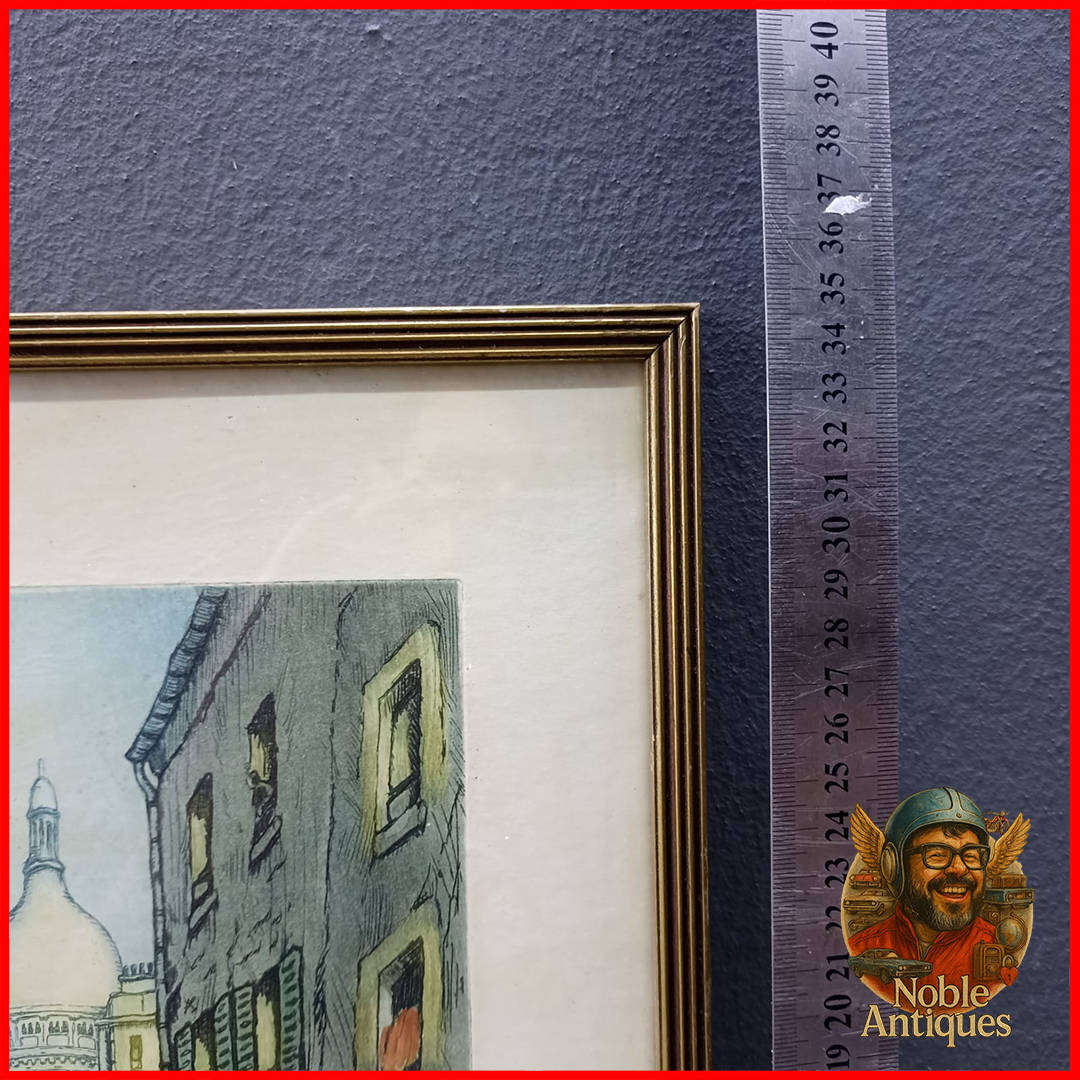 Framed artwork is a hand-colored etching by the French artist Marcel Julien Baron (1872-1956)