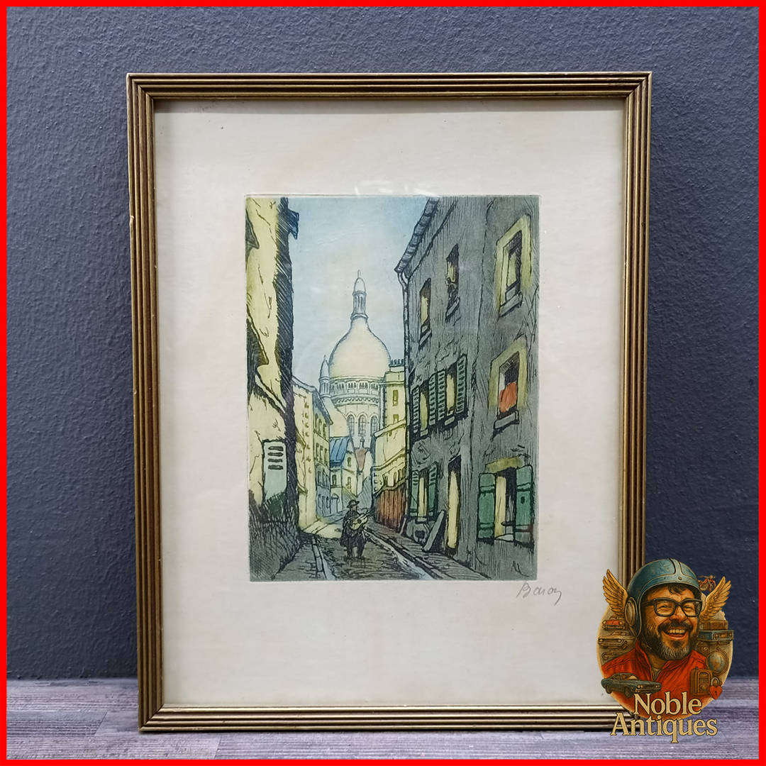 Framed artwork is a hand-colored etching by the French artist Marcel Julien Baron (1872-1956)