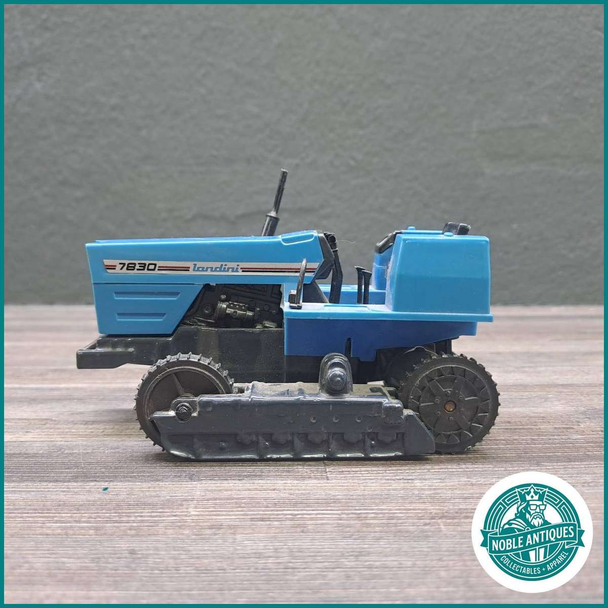 1:43 scale diecast model of a 1983 Landini C 7830 crawler tractor