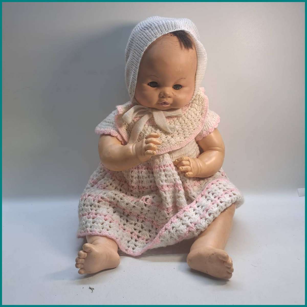 Vintage Ideal baby doll with molded plastic facial features