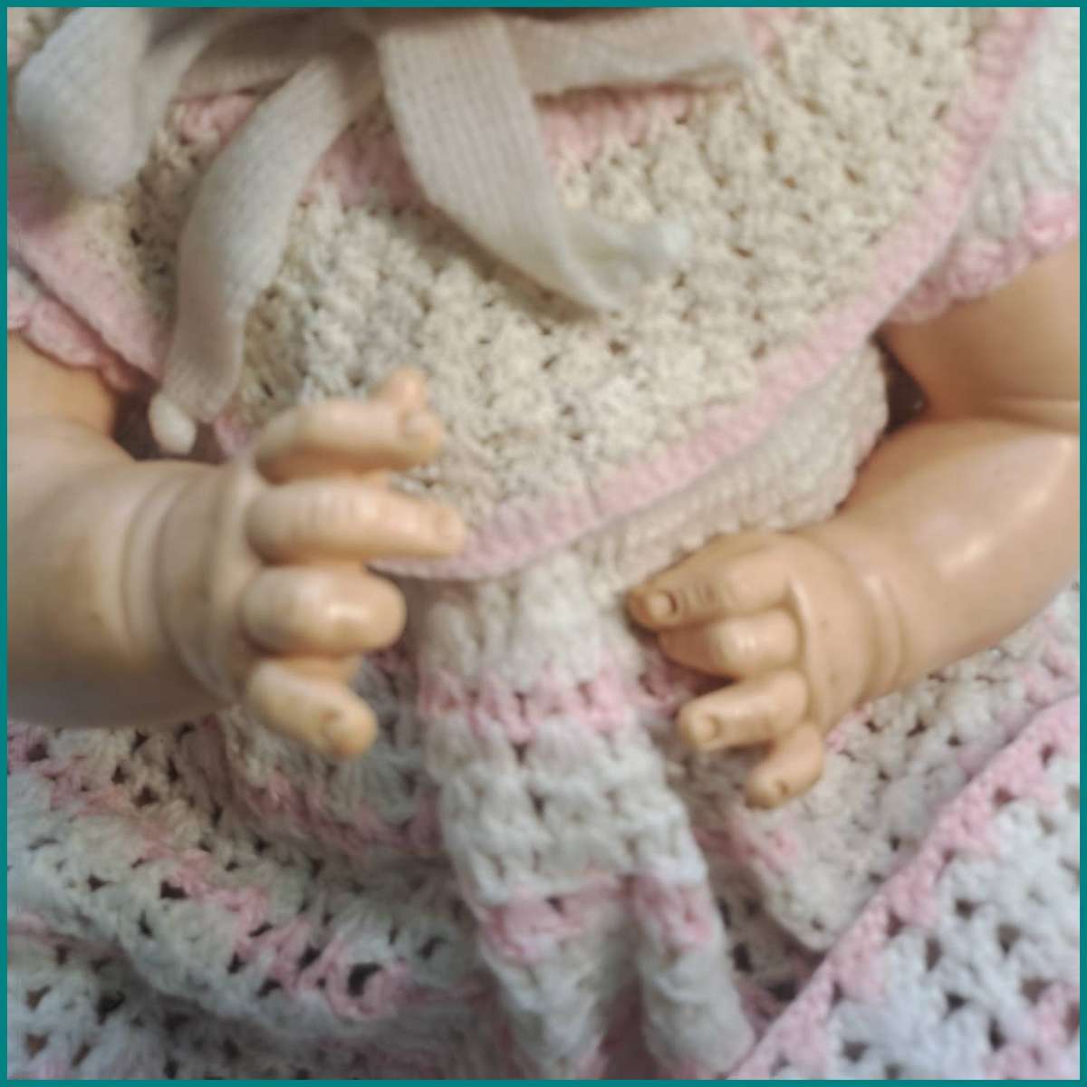 Vintage Ideal baby doll with molded plastic facial features