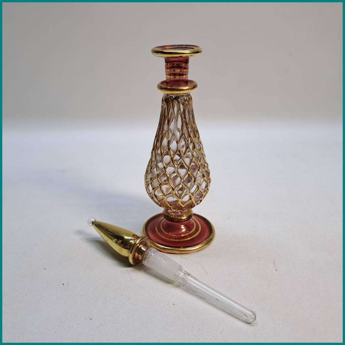 Vintage Ornate hand-blown Genie Egyptian perfume bottle gold filigree-style net pattern