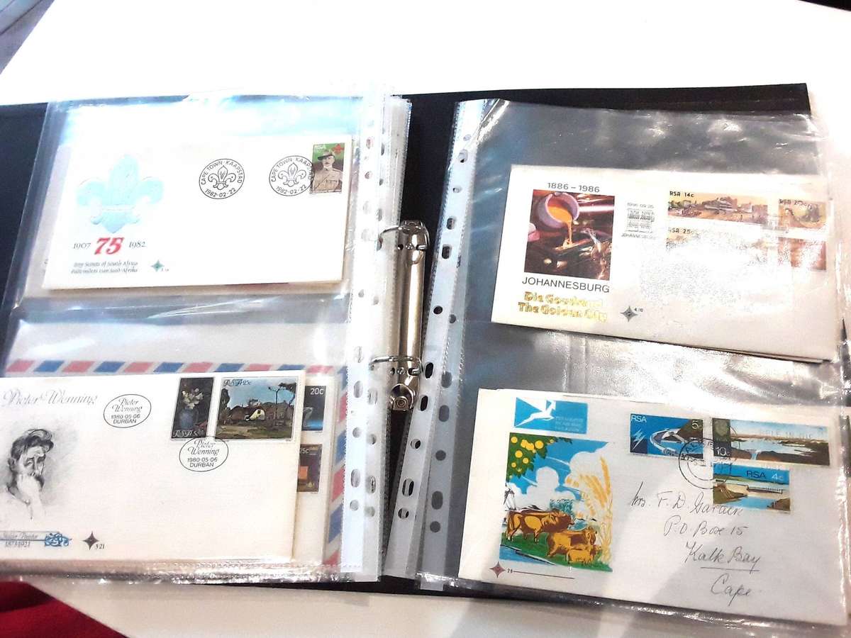 FDC's with mini sheets and stamps in ring file. Over 40. See photos