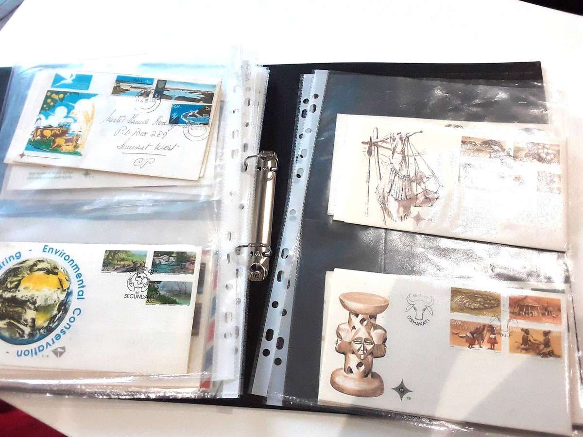 FDC's with mini sheets and stamps in ring file. Over 40. See photos