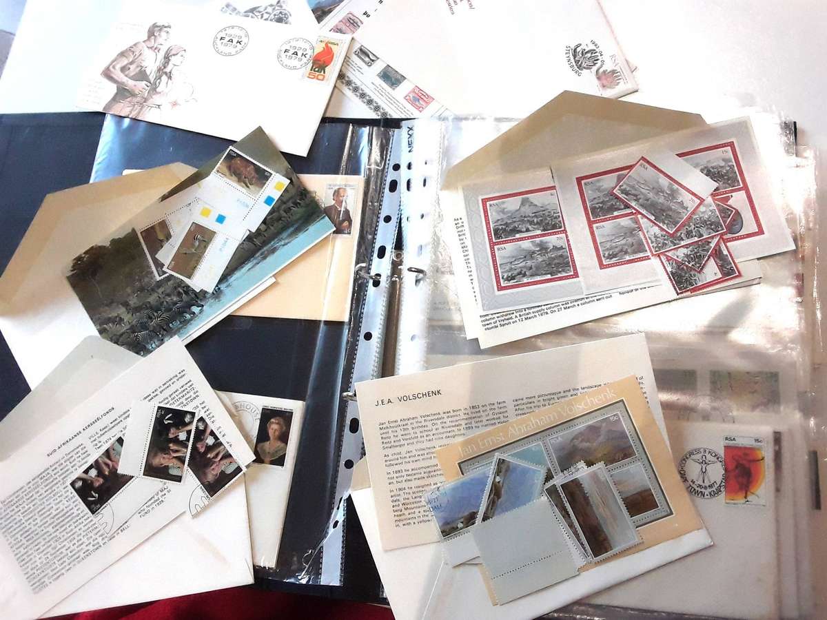 FDC's with mini sheets and stamps in ring file. Over 40. See photos