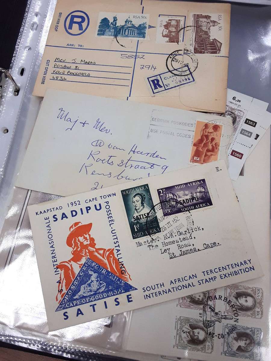 FDC's in Ring File with mint stamps and post cards.