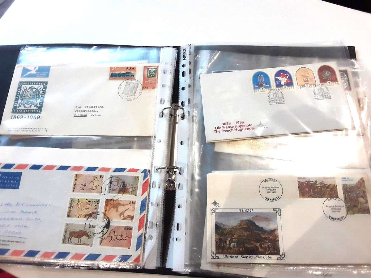 FDC's with mini sheets and stamps in ring file. Over 40. See photos