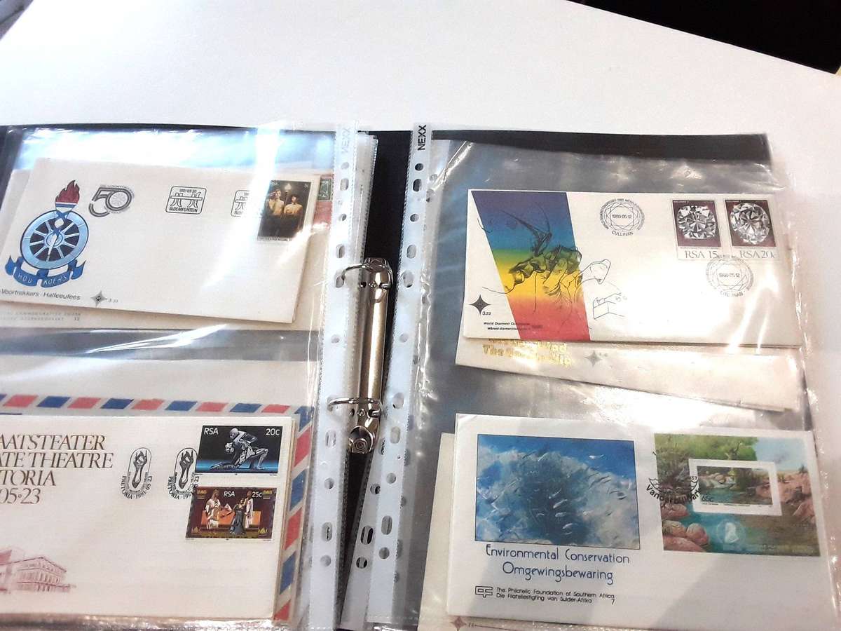 FDC's with mini sheets and stamps in ring file. Over 40. See photos