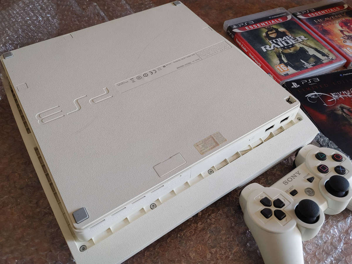 Rare white ps3 console with controller and games