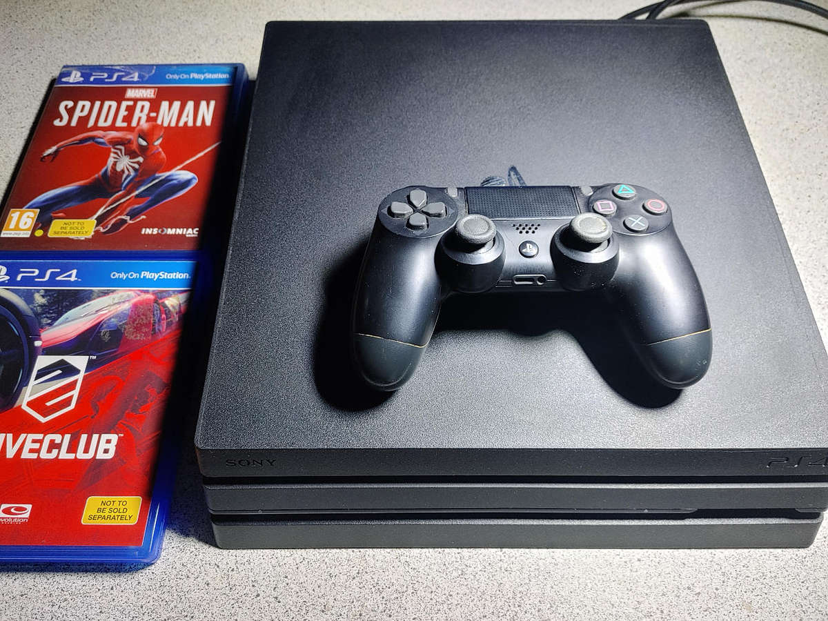 PS4 Pro with 1x Controller and 2x Games