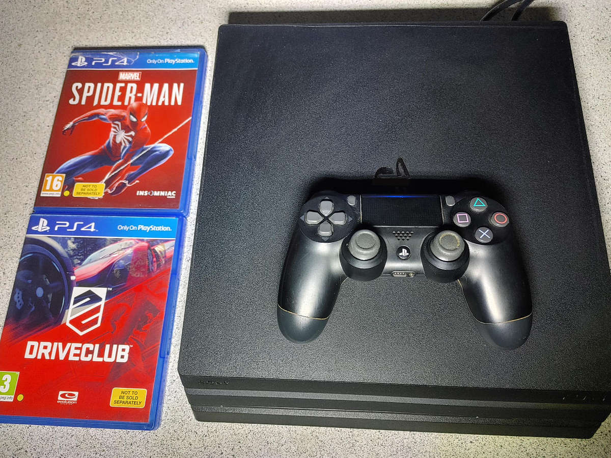 PS4 Pro with 1x Controller and 2x Games
