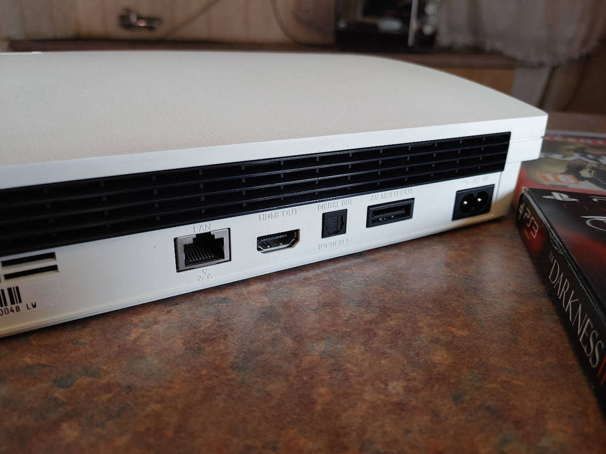 Rare white ps3 console with controller and games