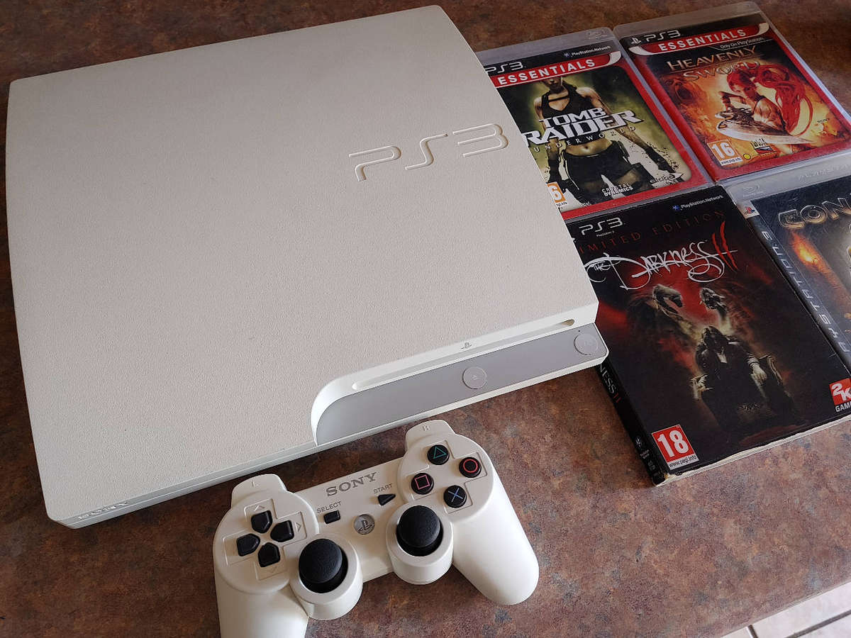 Rare white ps3 console with controller and games