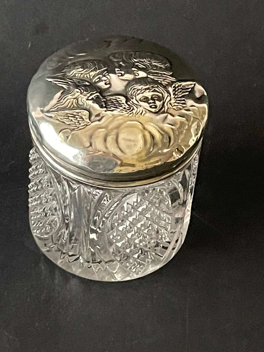 Sterling silver cut glass dressing table jar featuring cherub design