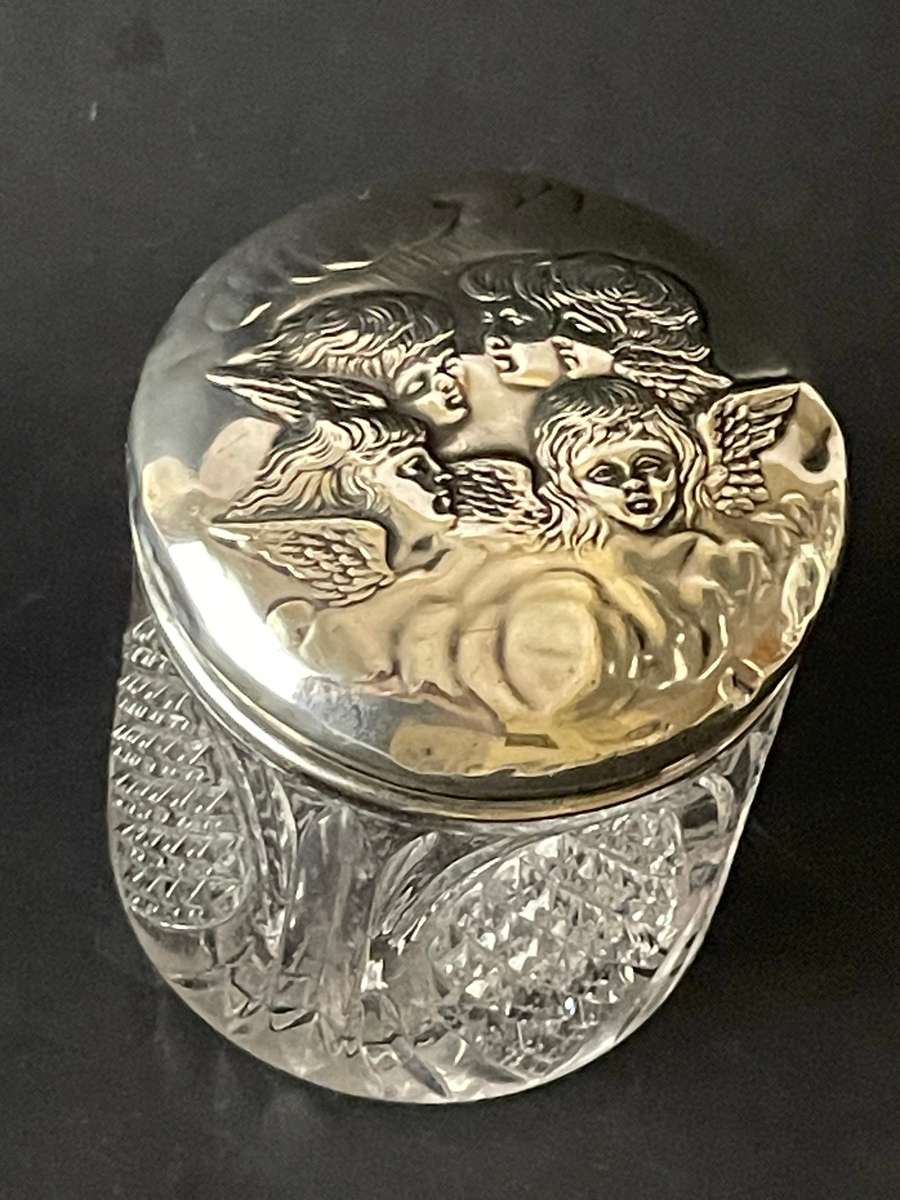 Sterling silver cut glass dressing table jar featuring cherub design