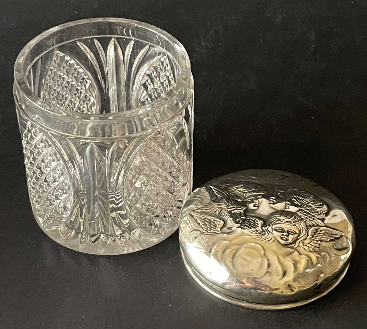 Sterling silver cut glass dressing table jar featuring cherub design