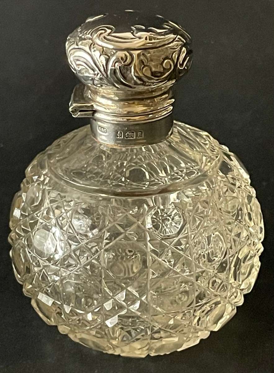 Hinged sterling silver topped cut glass perfume bottle