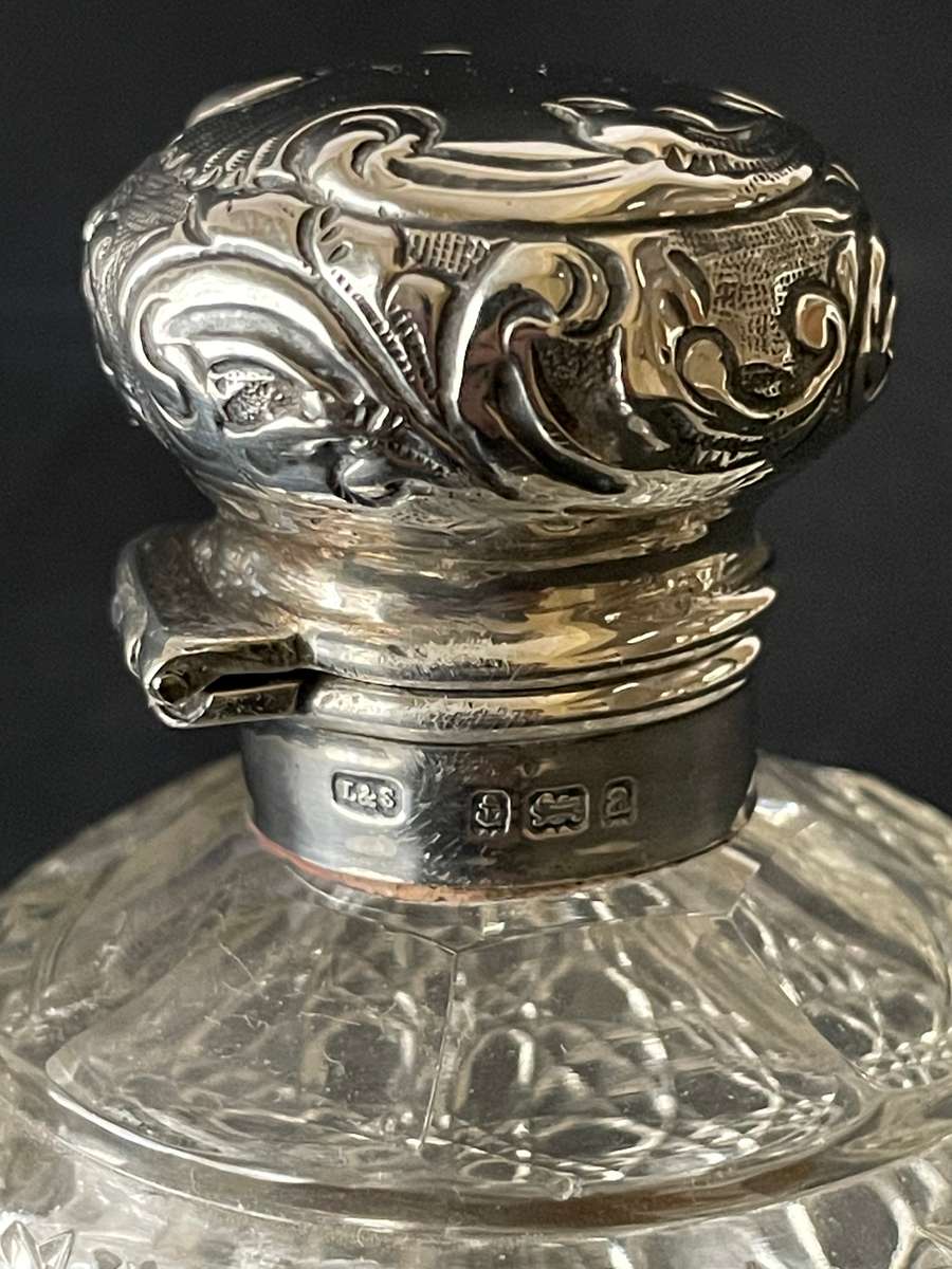 Hinged sterling silver topped cut glass perfume bottle