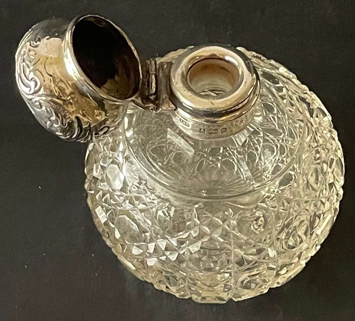 Hinged sterling silver topped cut glass perfume bottle