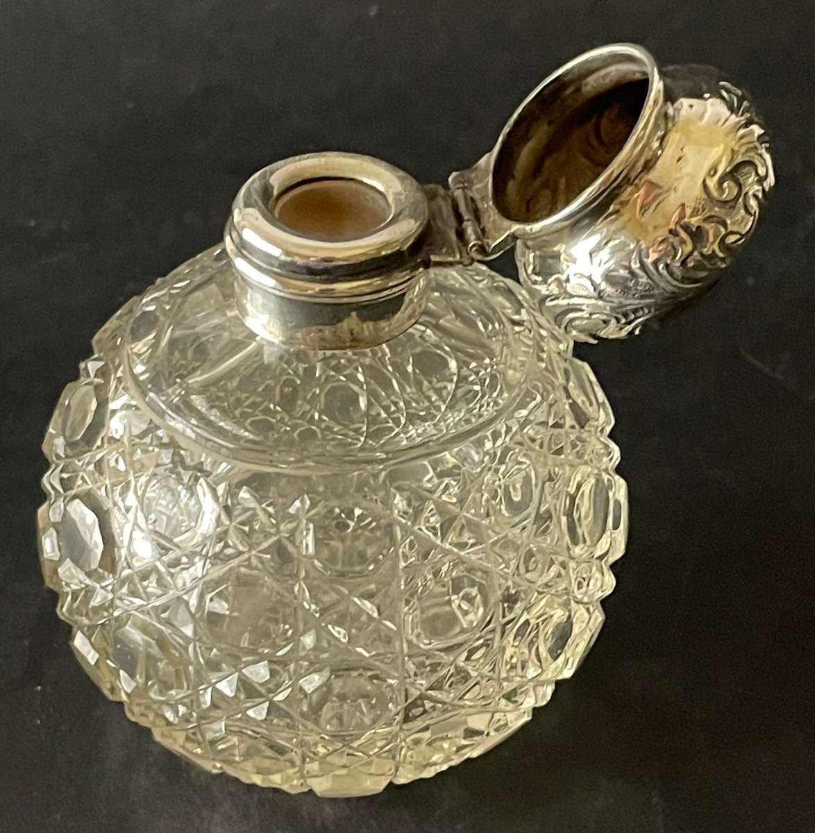 Hinged sterling silver topped cut glass perfume bottle