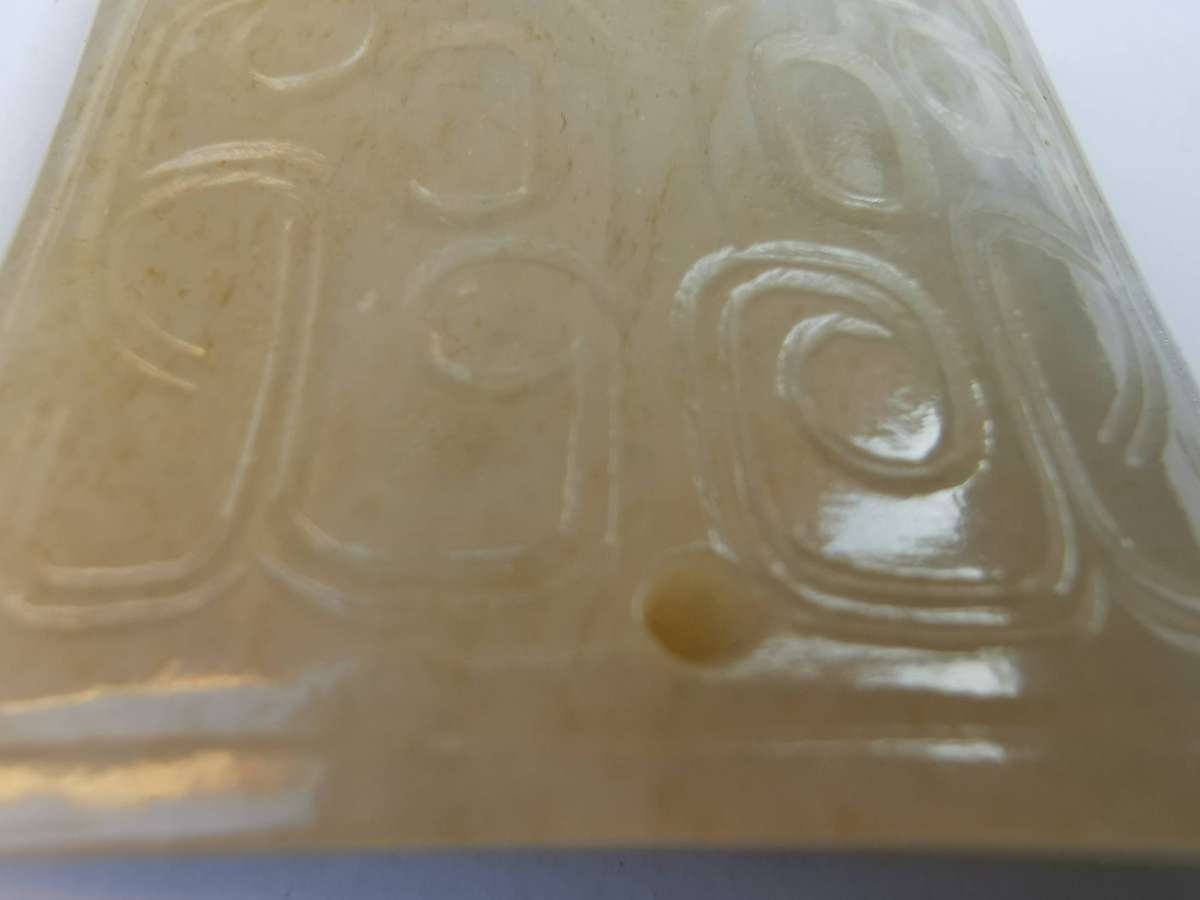 Chinese ancient jade pendant with coiled dragon patterns