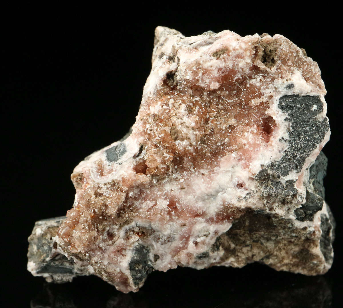 Rhodochrosite on Matrix,"N'Chwaning II Mine, Kalahari Manganese Field, Northern Cape, South Africa.
