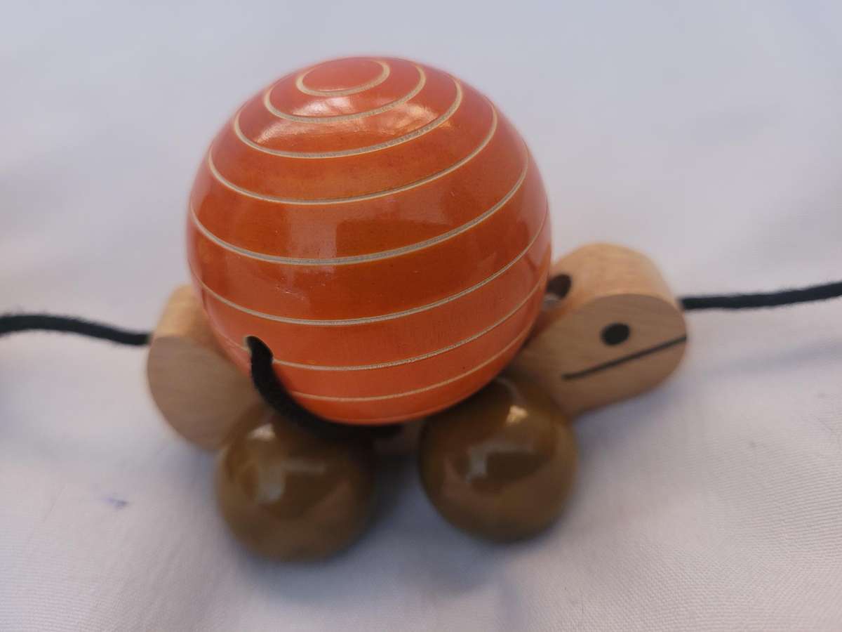 HAND MADE WOODEN TORTOISE-TRIPPLE PULL ALONG, FACINATING TOY. WHEELS TURN THE SHELLS. UNUSED.