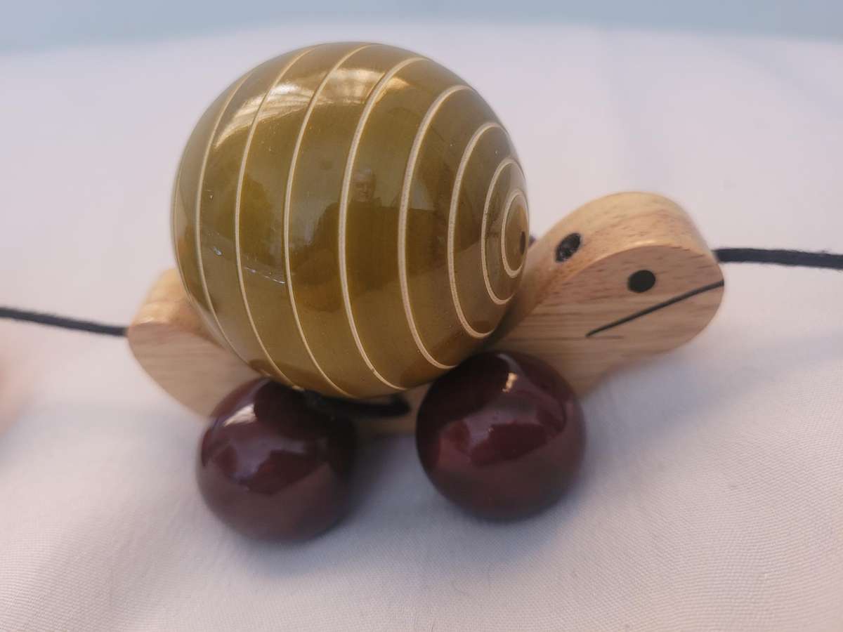 HAND MADE WOODEN TORTOISE-TRIPPLE PULL ALONG, FACINATING TOY. WHEELS TURN THE SHELLS. UNUSED.