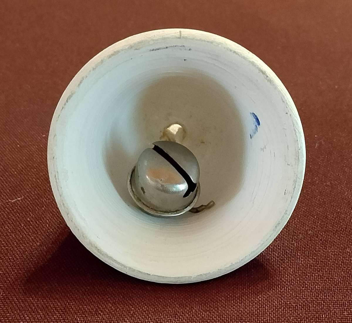 Handcrafted ceramic bell with blue and white floral motif