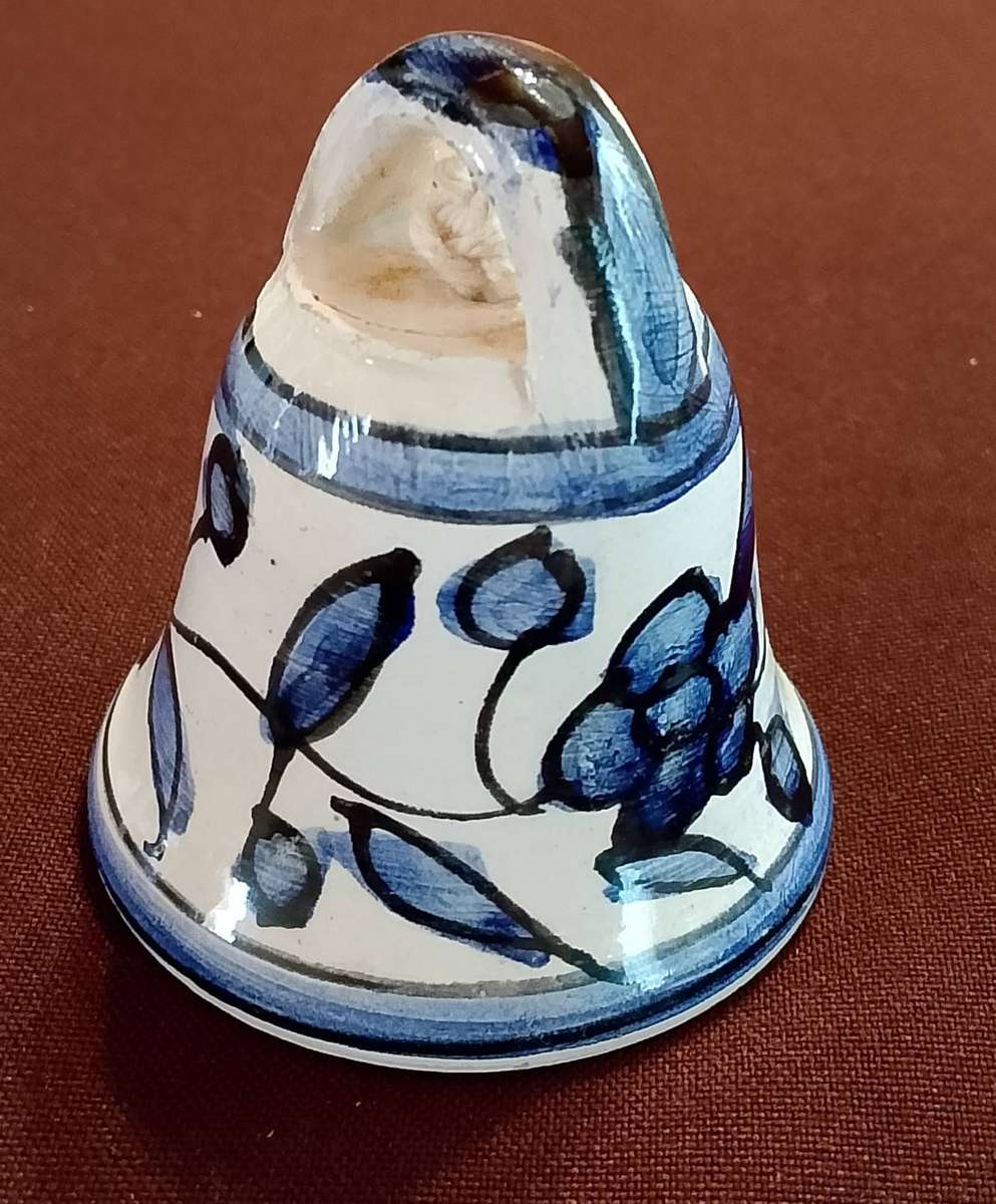 Handcrafted ceramic bell with blue and white floral motif
