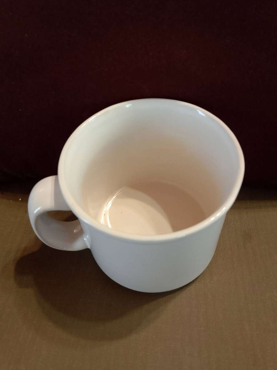 Ceramic soup mug featuring a classic onion soup recipe on the side