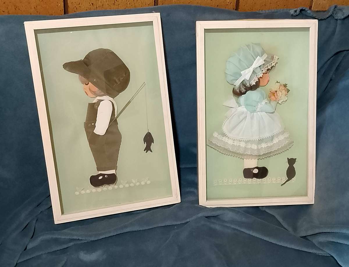 Framed pictures of girl and boy