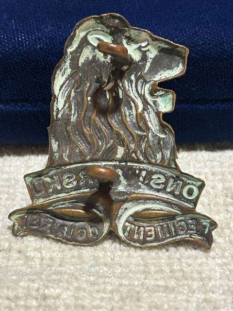 Vintage brass cap badge of the South African Army's Regiment de la Rey
