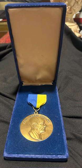 Paul Harris Fellow award, which includes the medallion