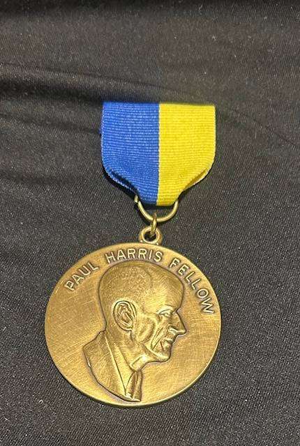 Paul Harris Fellow award, which includes the medallion