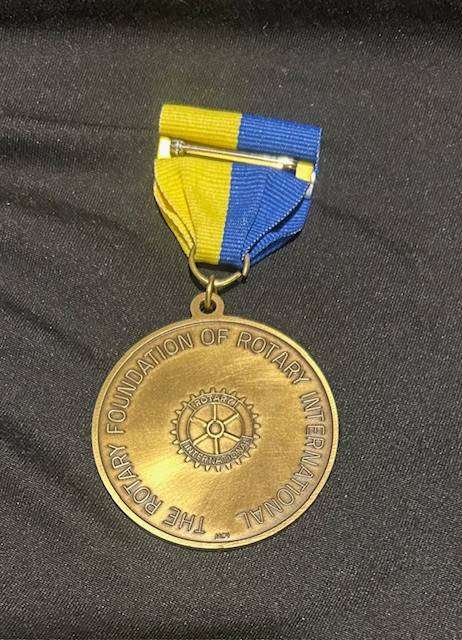 Paul Harris Fellow award, which includes the medallion