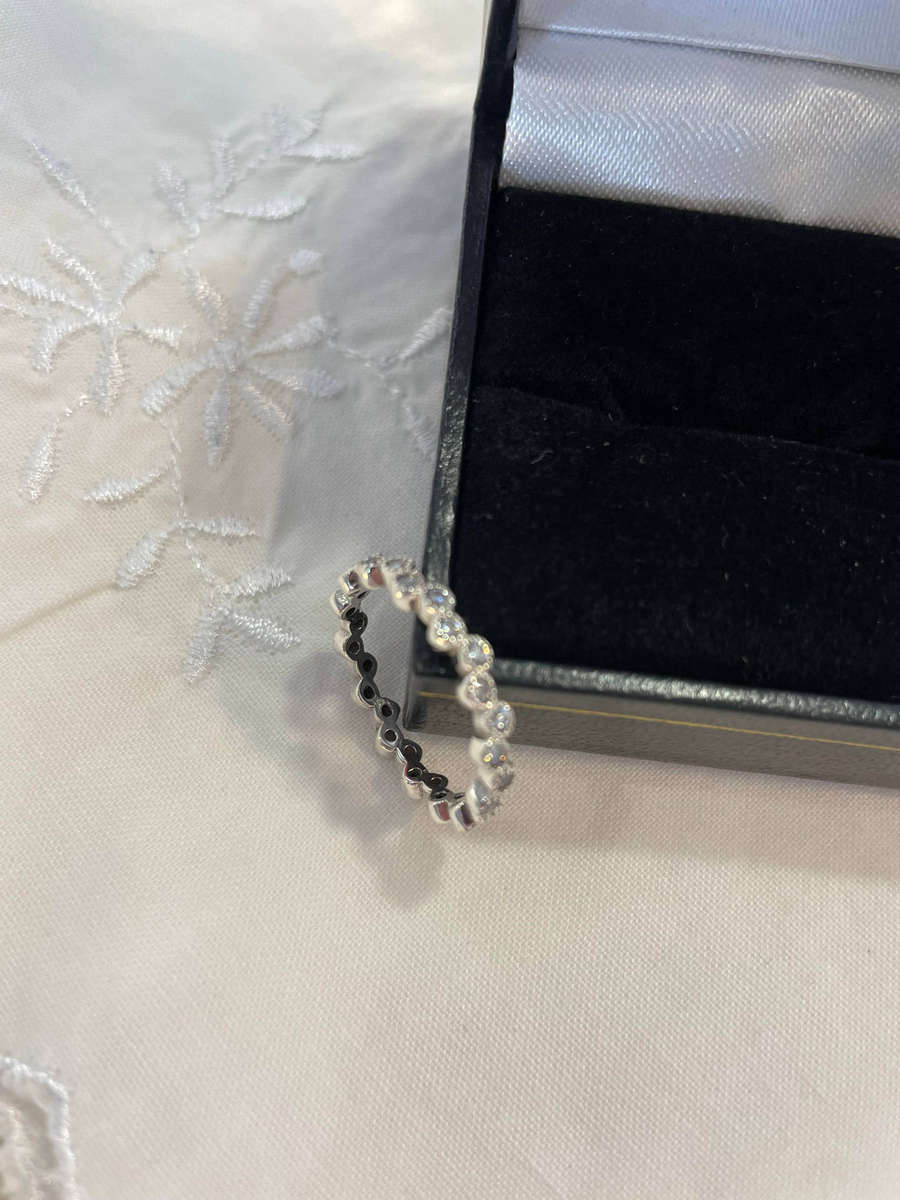 Sterling Silver "925" stamped round Eternity Wedding Band ring with accent CZ'S!