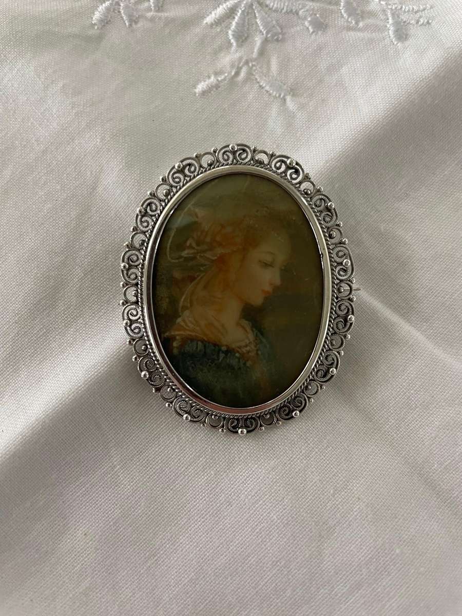 Delicate as a rose petal! Hand painted young lady set in solid silver (800) frame/ornate scrolling!!