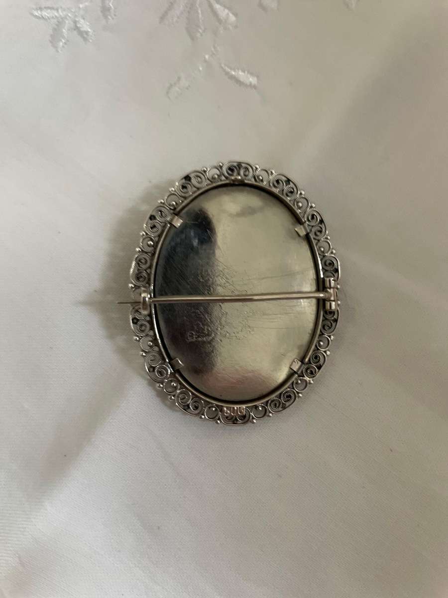 Delicate as a rose petal! Hand painted young lady set in solid silver (800) frame/ornate scrolling!!