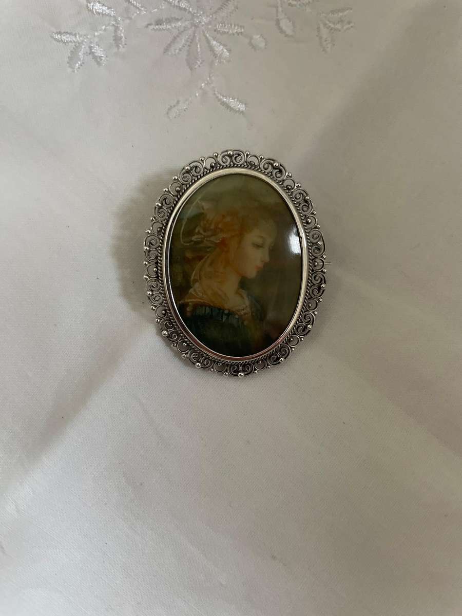Delicate as a rose petal! Hand painted young lady set in solid silver (800) frame/ornate scrolling!!