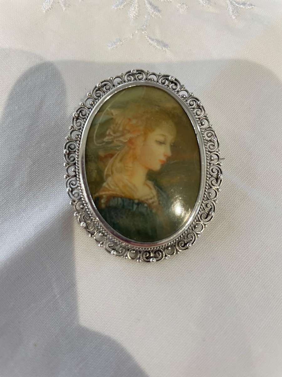 Delicate as a rose petal! Hand painted young lady set in solid silver (800) frame/ornate scrolling!!