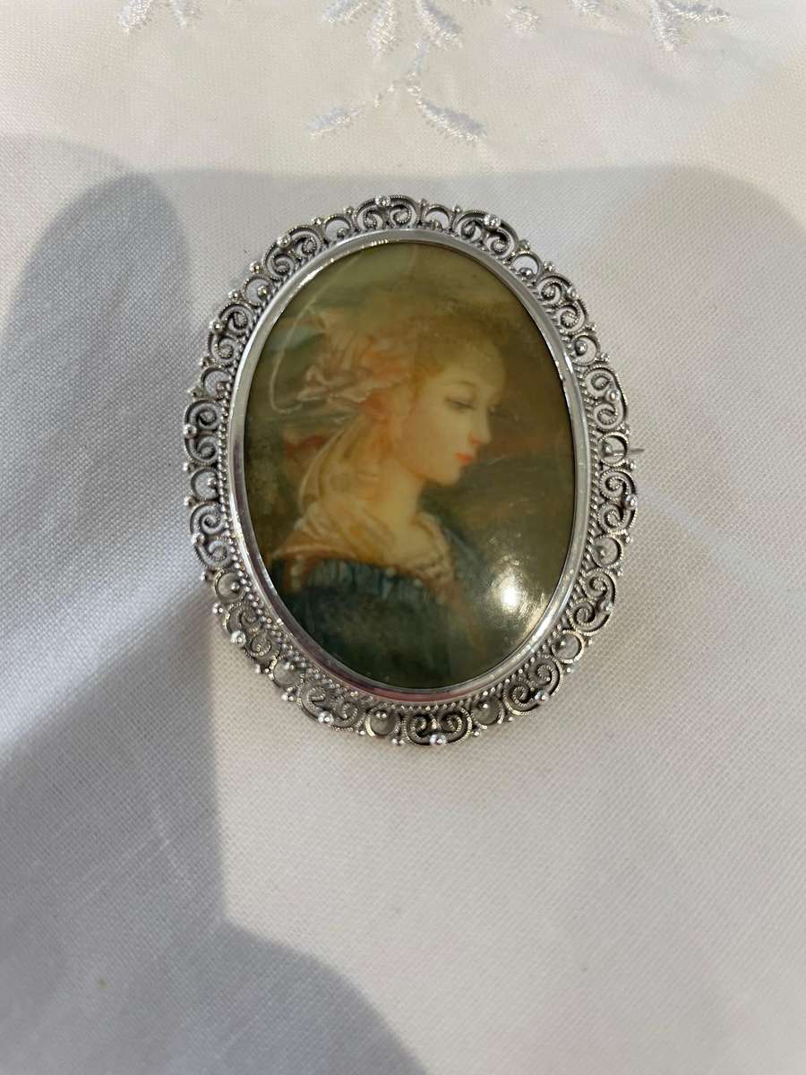 Delicate as a rose petal! Hand painted young lady set in solid silver (800) frame/ornate scrolling!!
