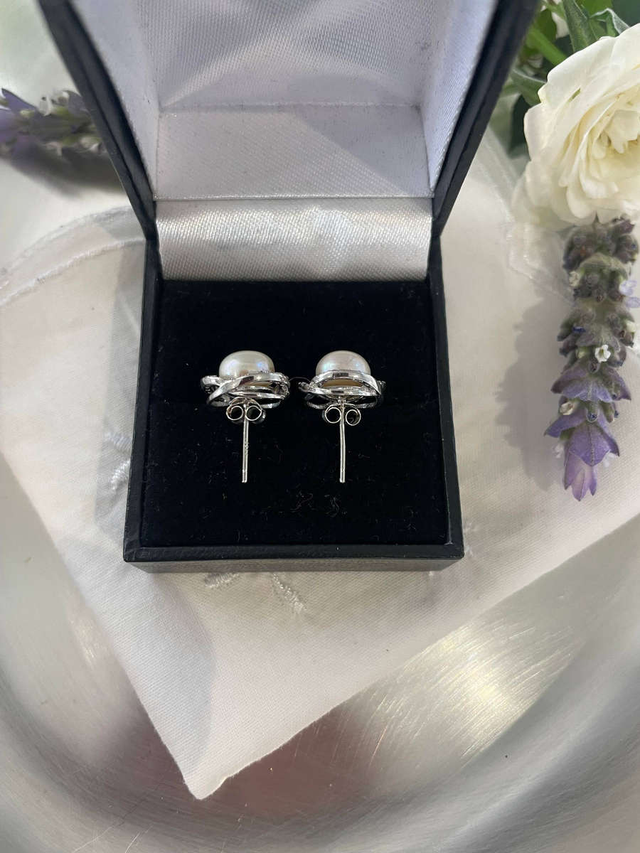 Enhanced cultured freshwater pearls set in 925 sterling silver.