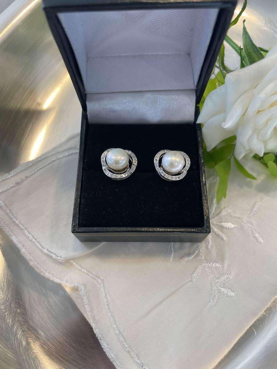 Enhanced cultured freshwater pearls set in 925 sterling silver.