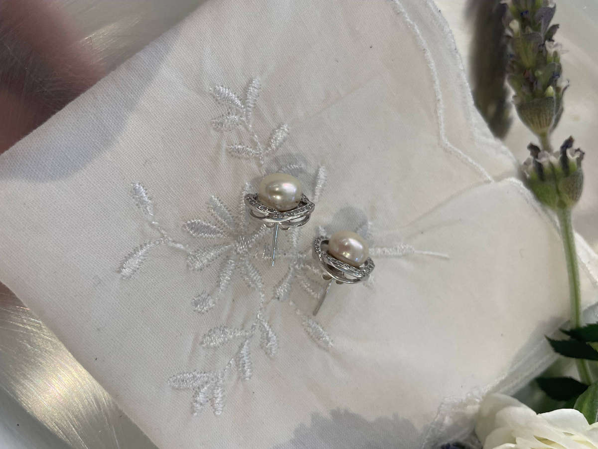 Enhanced cultured freshwater pearls set in 925 sterling silver.